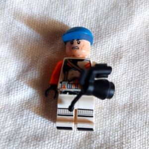 LEGO minifigure with a blue hat and accessorie